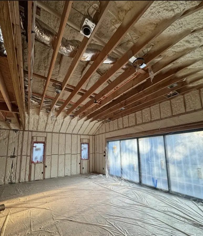Interior walls and ceiling insulated with spray foam during new construction in Liberty Hill